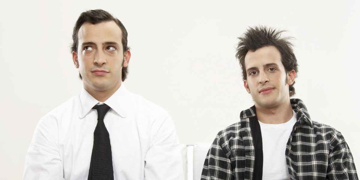 Young male twins wearing formal and casual attire, portrait, close-up