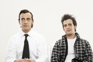 Young male twins wearing formal and casual attire, portrait, close-up