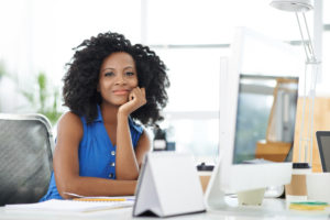 Portrait of attractive confident business lady at her workplace