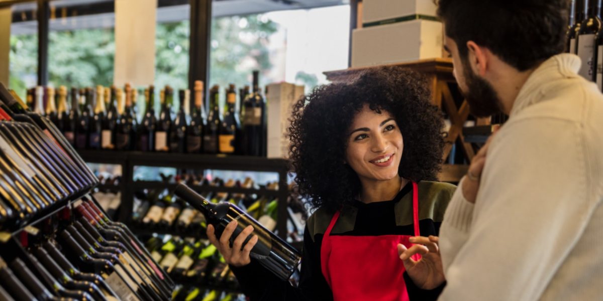 Man with consultant in winery shop