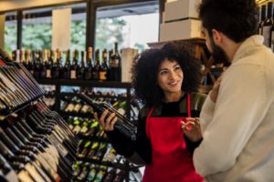 Man with consultant in winery shop