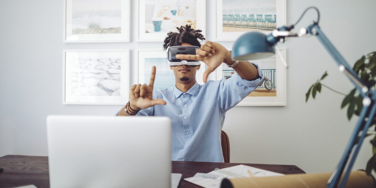 Young man at home using AI devices